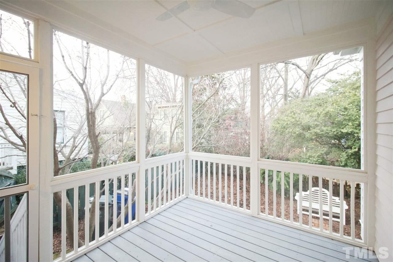 407 Polk Street Raleigh, NC 27604 - Photo 25 of 25 a view of a wooden balcony with wooden chairs