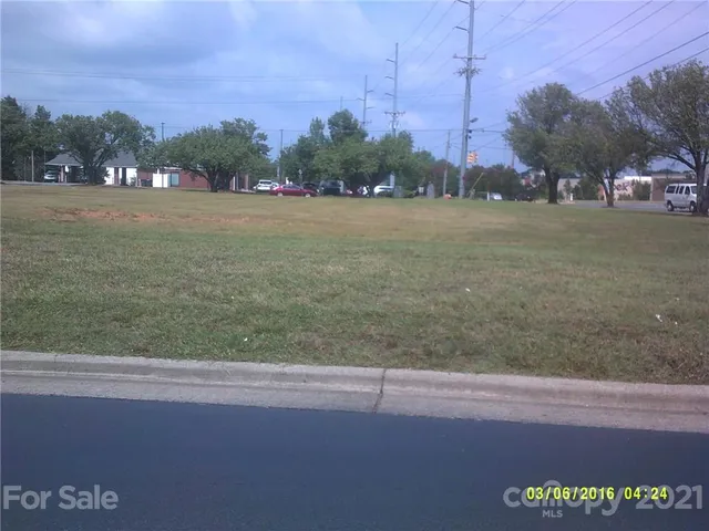 a view of a field with a sign board