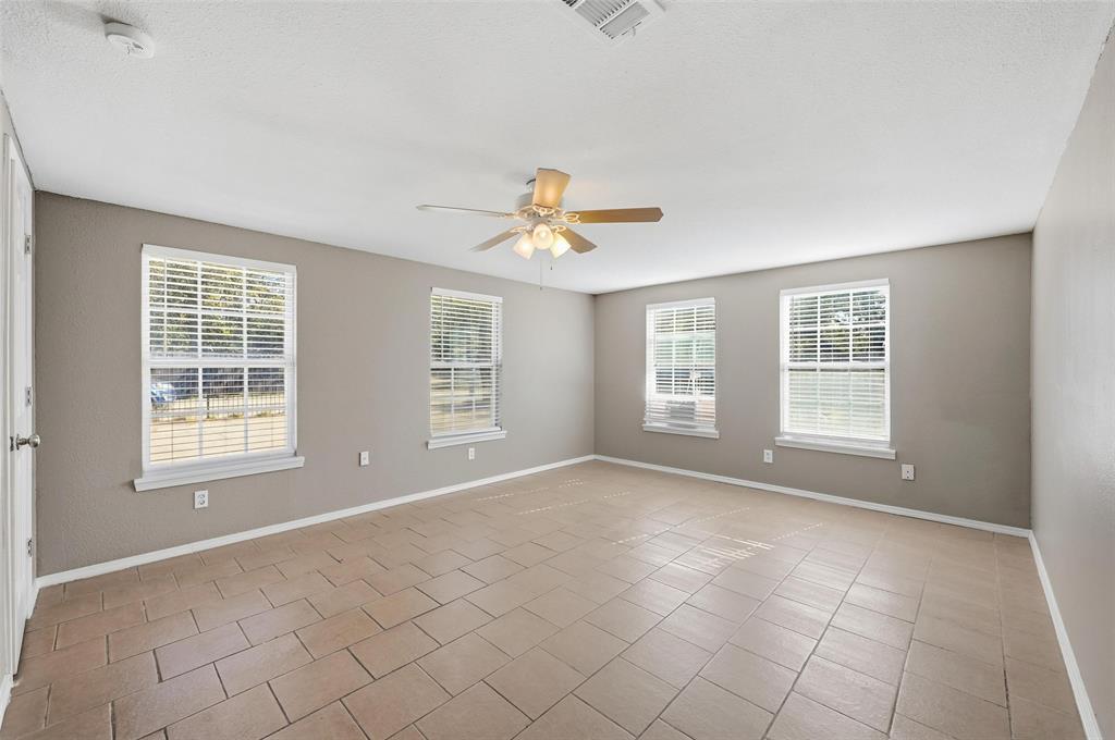 13485 Liberty School Road, Unit 1 Azle, TX 76020 - Photo 13 of 21 a view of an empty room with a window