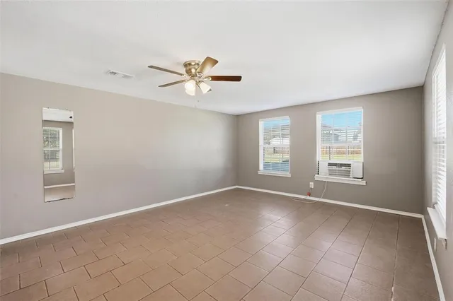 a view of an empty room with a window