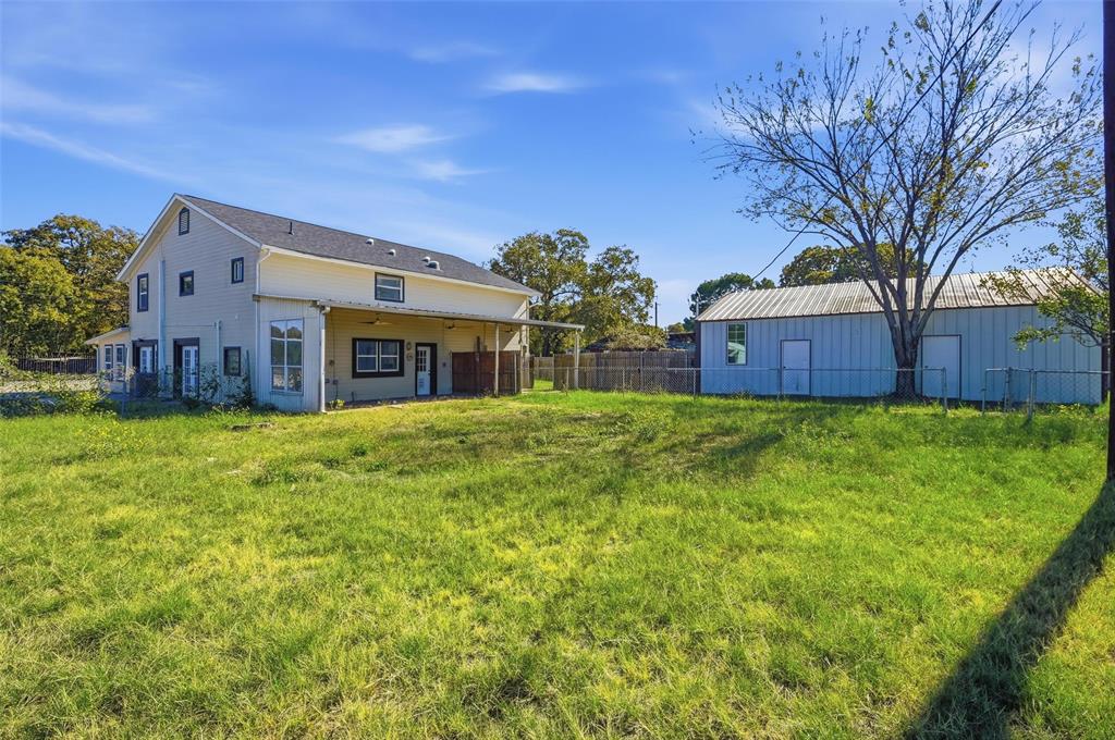 13485 Liberty School Road, Unit 1 Azle, TX 76020 - Photo 20 of 21 a large tree in front of a house