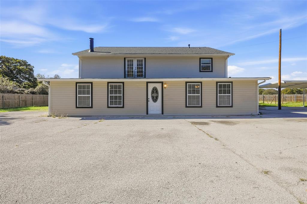13485 Liberty School Road, Unit 1 Azle, TX 76020 - Photo 2 of 21 a front view of a house with garage