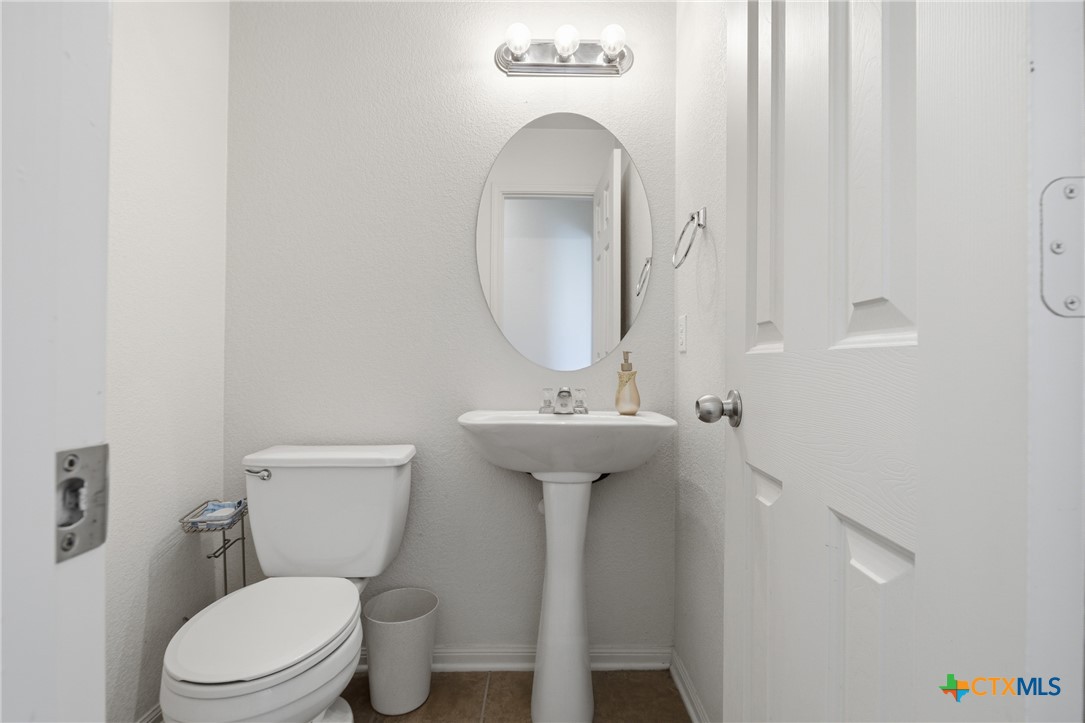 3310 Bull Run Drive Killeen, TX 76549 - Photo 16 of 27 a bathroom with a toilet sink and mirror