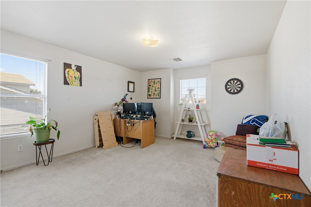 3310 Bull Run Drive Killeen, TX 76549 - Photo 20 of 27 a living room with furniture and a flat screen tv