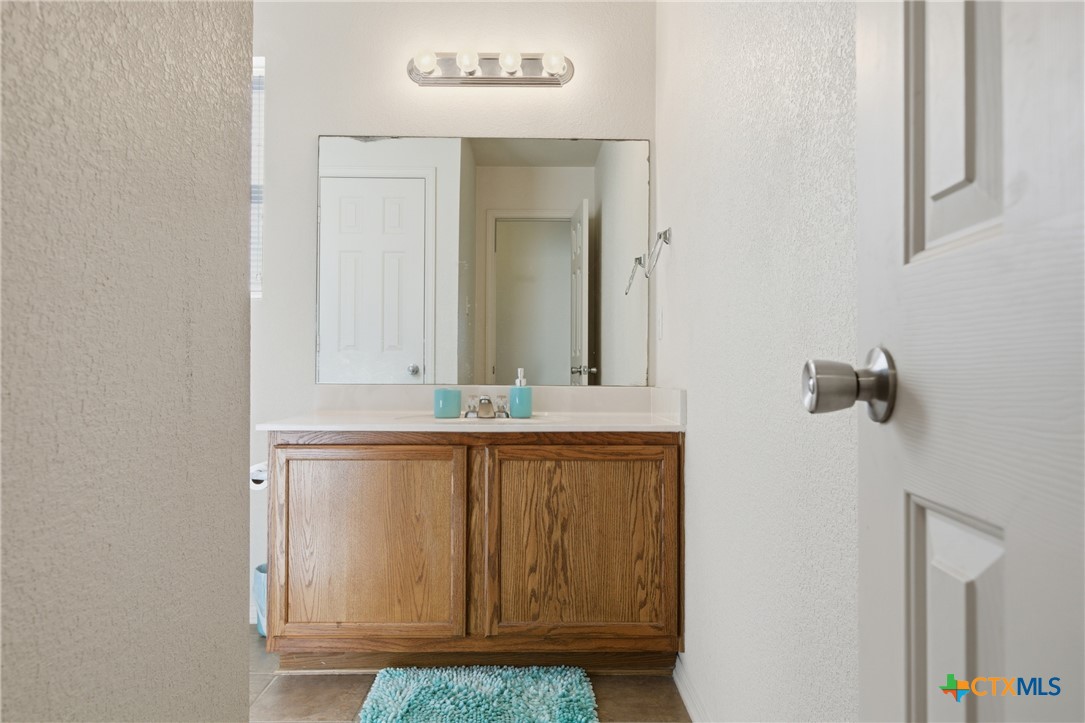 3310 Bull Run Drive Killeen, TX 76549 - Photo 22 of 27 a bathroom with a sink and a mirror