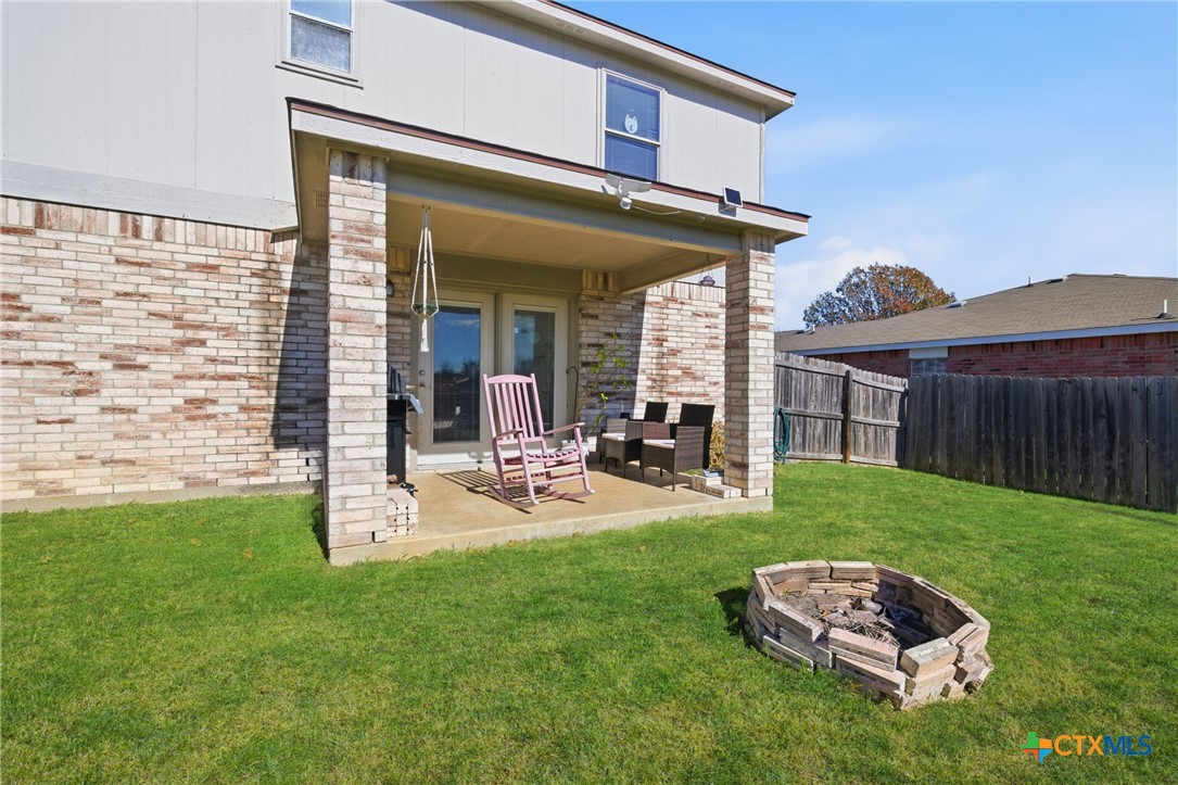 3310 Bull Run Drive Killeen, TX 76549 - Photo 25 of 27 a view of a backyard with table and chairs and potted plants