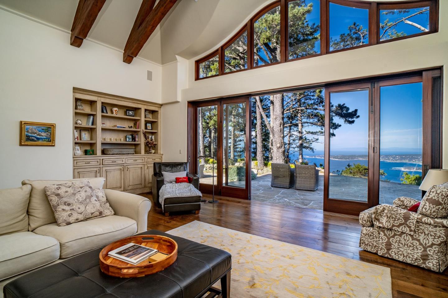 309 Mt Devon Road Carmel, CA 93923 - Photo 11 of 32 a living room with furniture and a large window