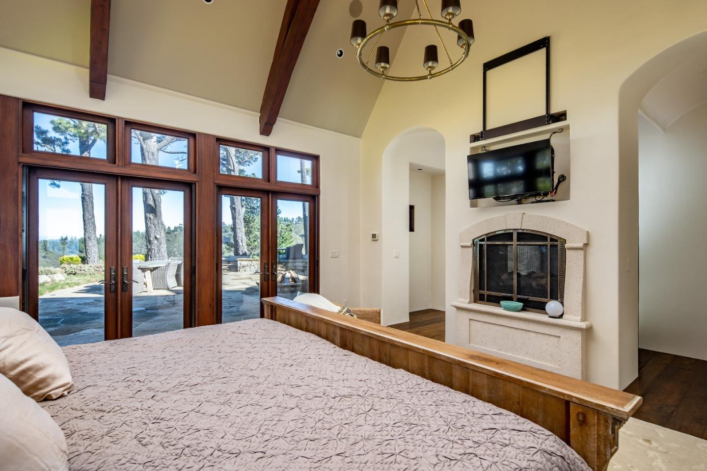 309 Mt Devon Road Carmel, CA 93923 - Photo 23 of 32 a bedroom with furniture and a flat screen tv