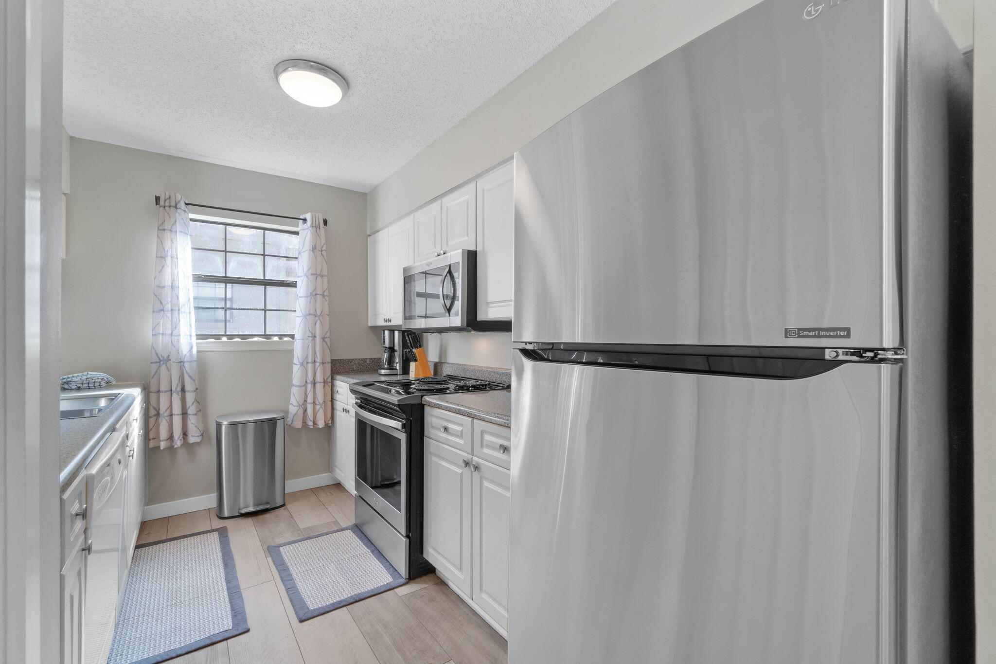 15 Cypress Street, Unit 268 Santa Rosa Beach, FL 32459 - Photo 8 of 44 a kitchen with a refrigerator stove and sink