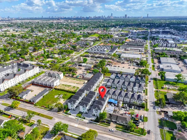 an aerial view of residential houses and outdoor space