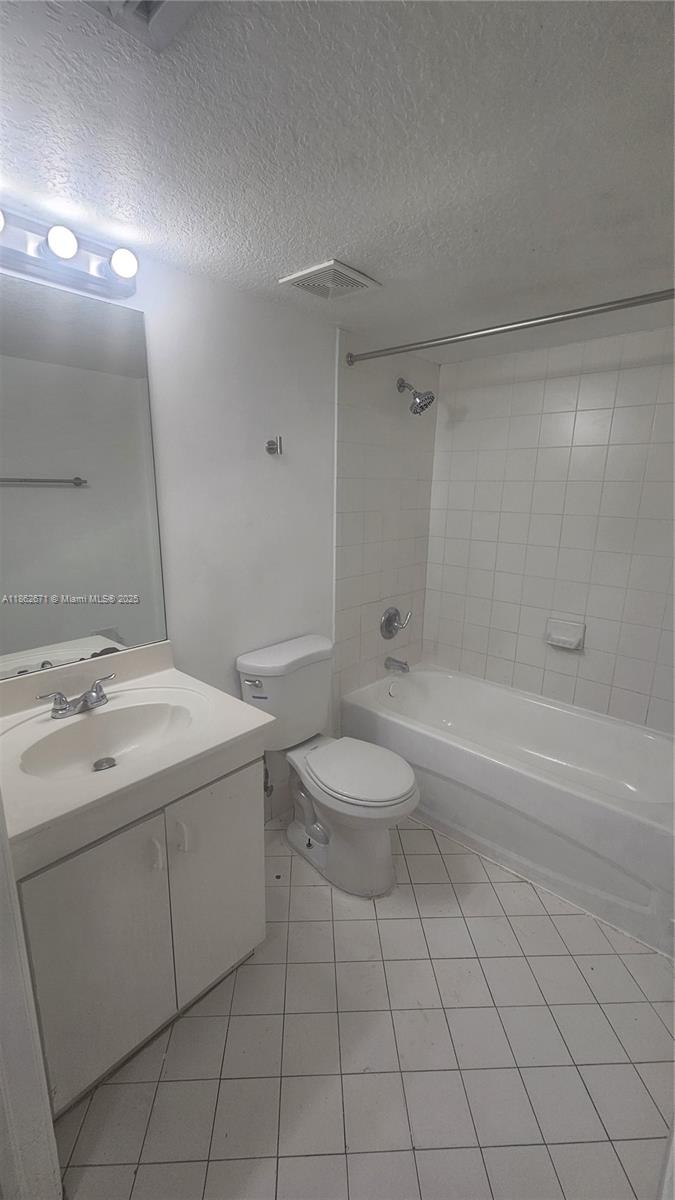 1301 Southeast 28th Lane, Unit 10142 Homestead, FL 33035 - Photo 7 of 9 a bathroom with a sink a toilet and shower