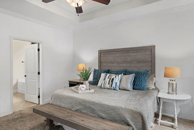 a bedroom with a bed and a table