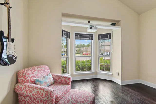 a bedroom with furniture and a window