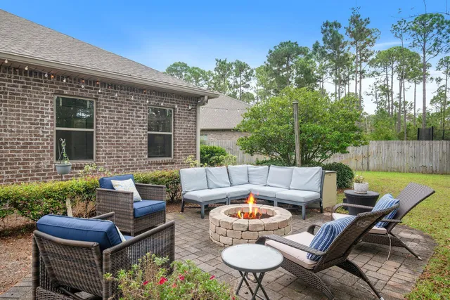 a backyard of a house with outdoor seating