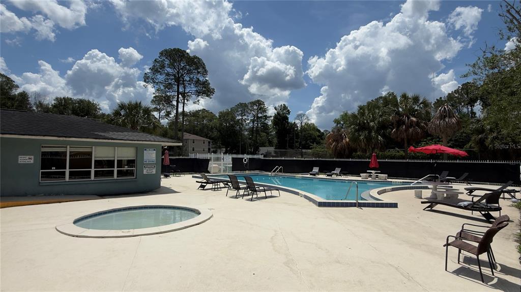 501 Southwest 75th Street, Unit B5 Gainesville, FL 32607 - Photo 36 of 38 a view of a backyard with sitting area