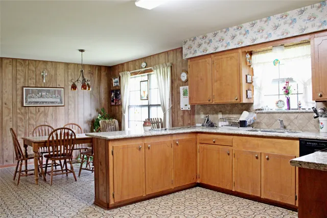 a view of a kitchen area with furniture and window