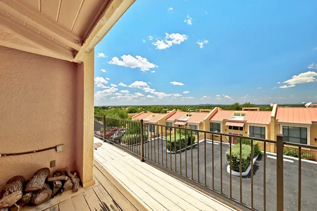 a view of balcony with furniture