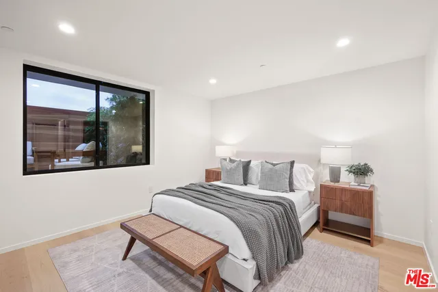 a bedroom with a bed and a walk in closet