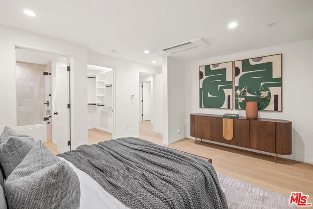 a bedroom with a bed and a table