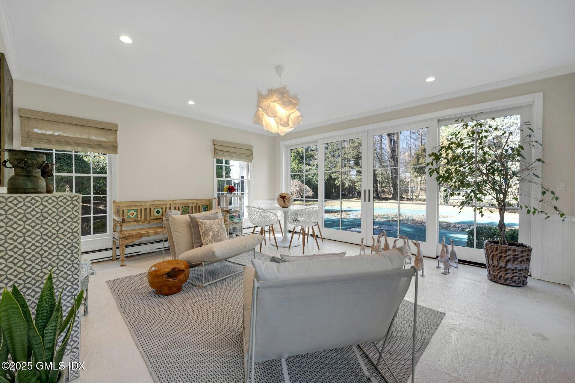 1 Ivanhoe Lane Greenwich, CT 06830 - Photo 4 of 27 a living room with furniture and a large window