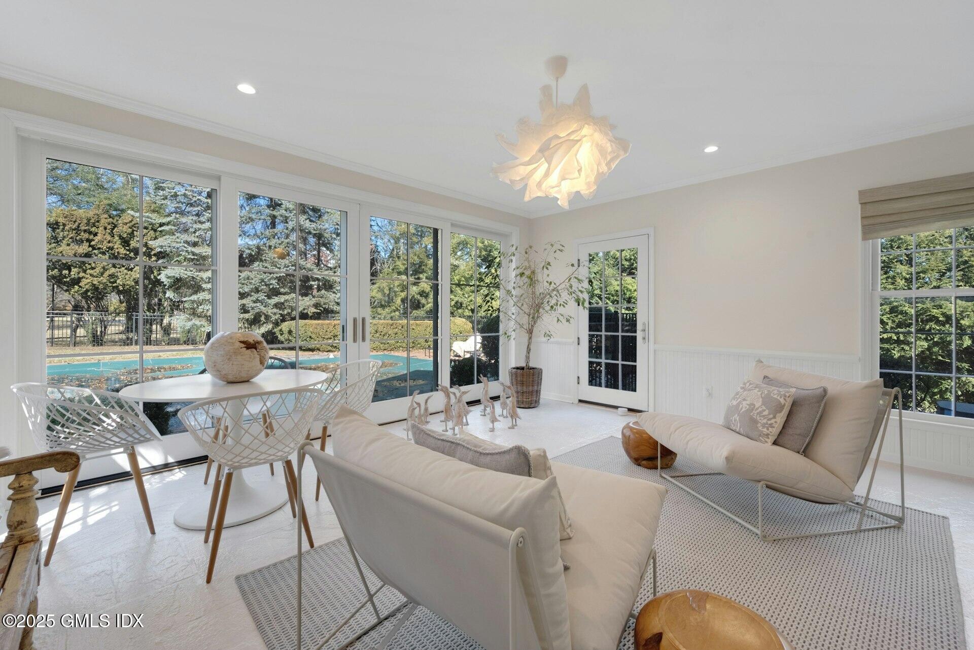 1 Ivanhoe Lane Greenwich, CT 06830 - Photo 5 of 27 a view of a dining room with furniture wooden floor and chandelier