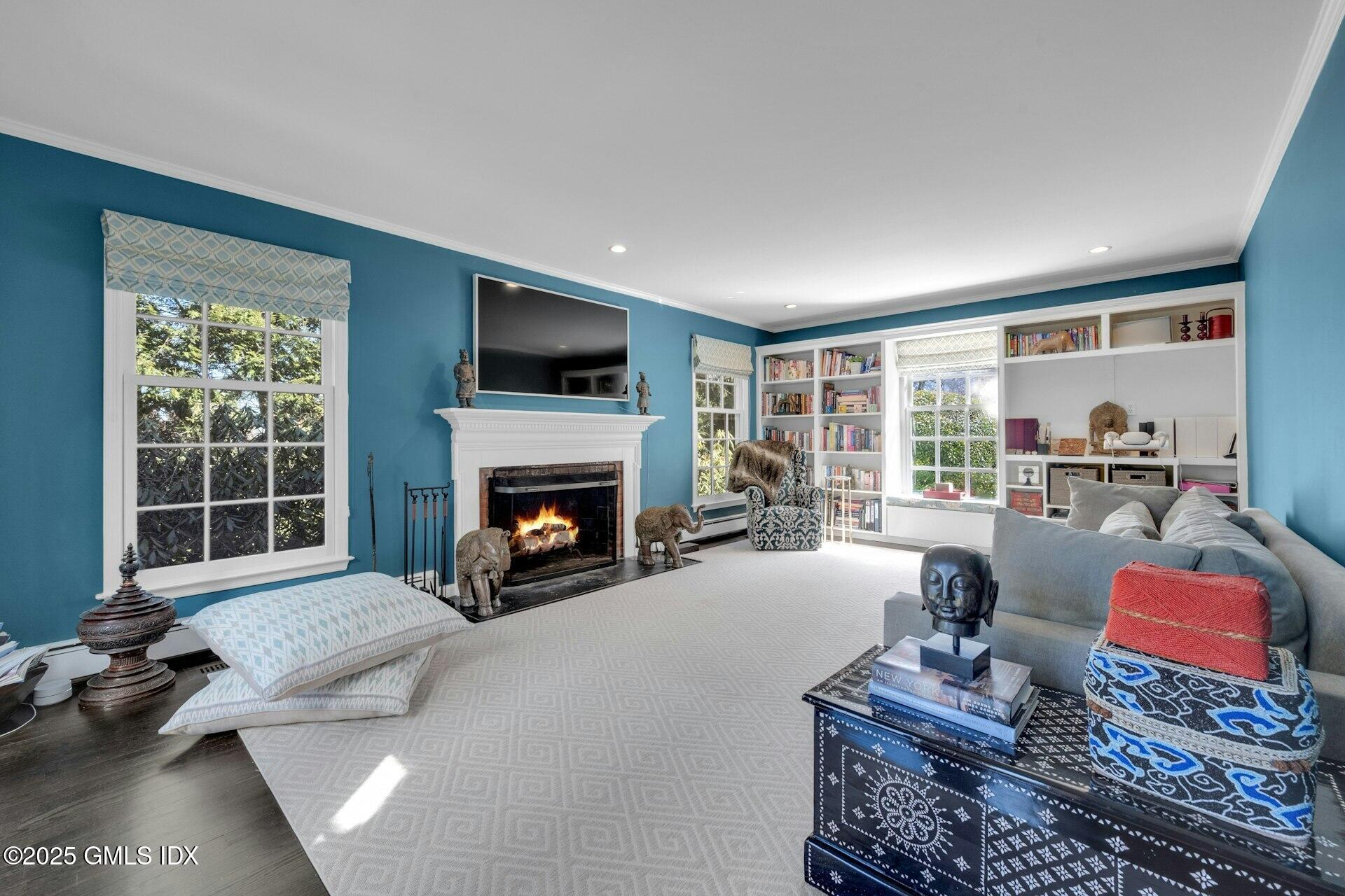 1 Ivanhoe Lane Greenwich, CT 06830 - Photo 10 of 27 a living room with furniture fireplace and flat screen tv