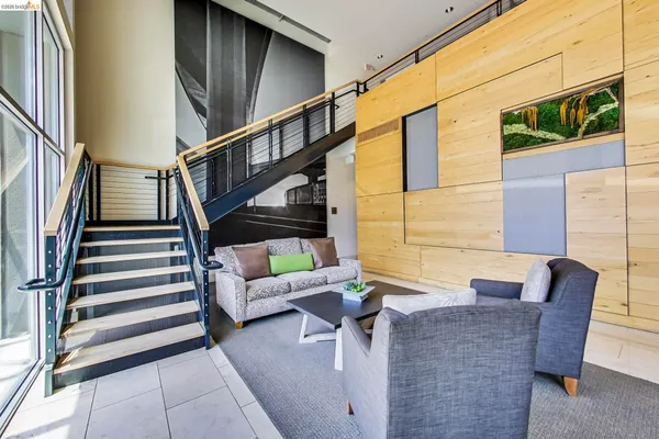 a room with pool table and windows