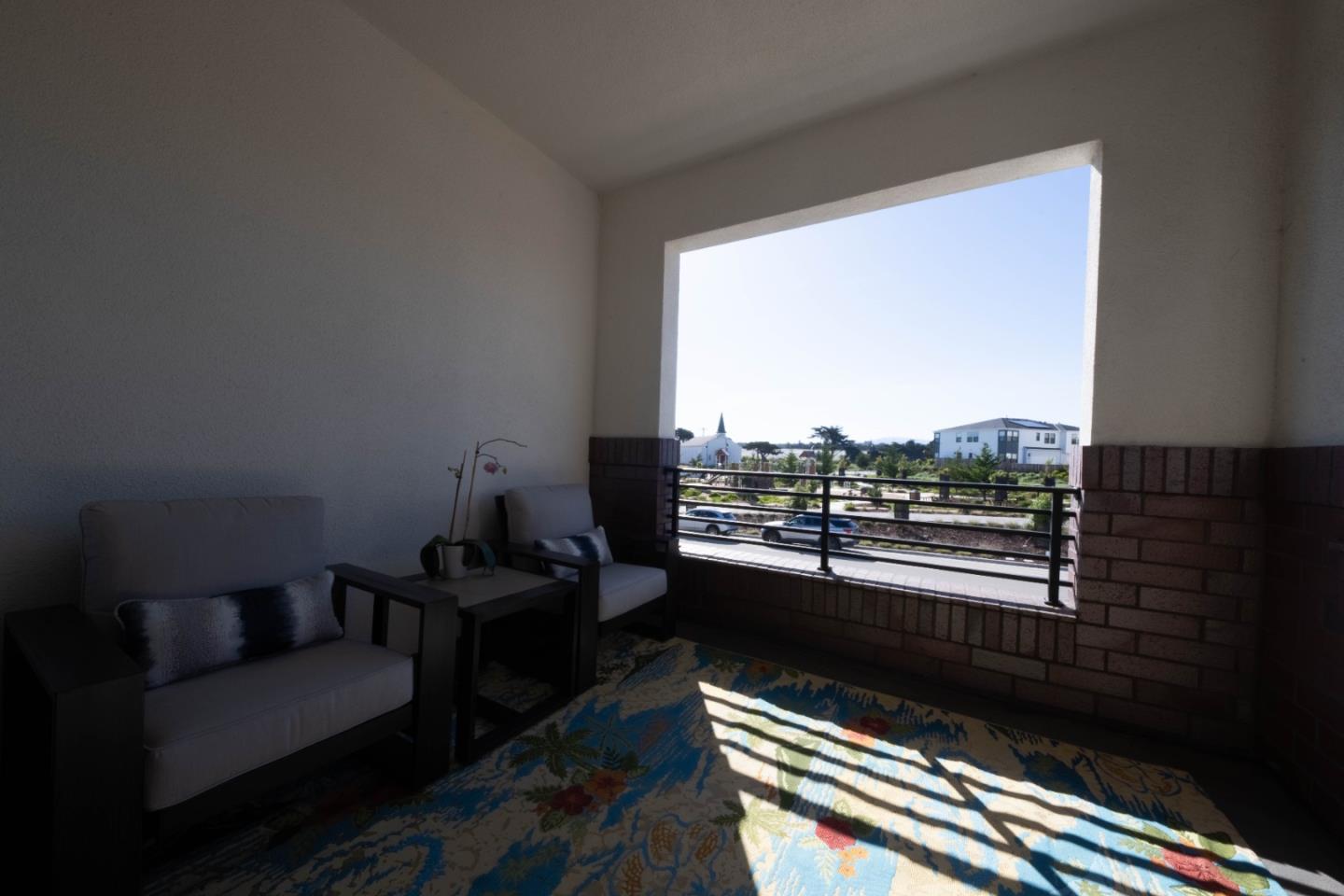 135 8th Street Marina, CA 93933 - Photo 26 of 69 a living room with furniture and a floor to ceiling window