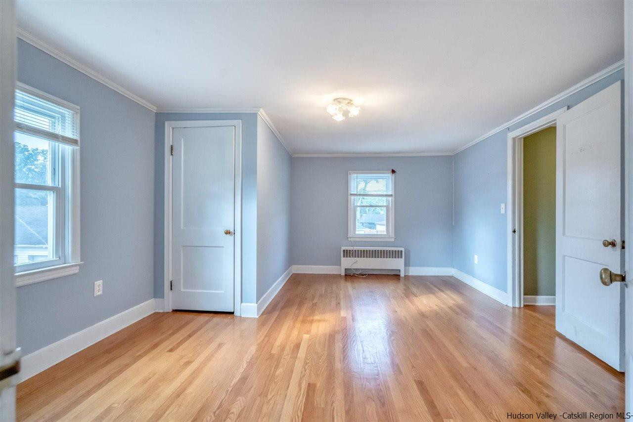 23 Spaulding Lane Saugerties, NY 12477 - Photo 14 of 35 an empty room with wooden floor and windows