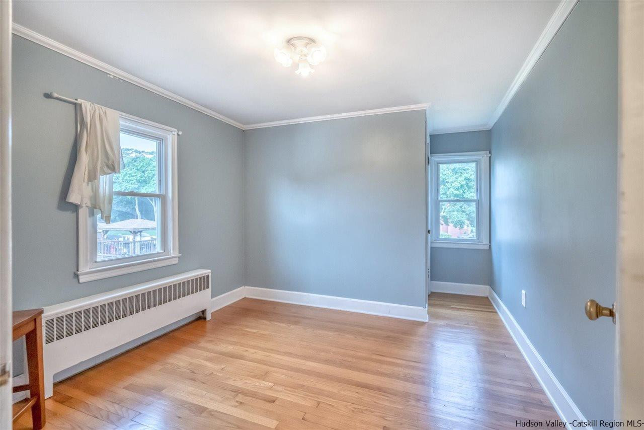 23 Spaulding Lane Saugerties, NY 12477 - Photo 16 of 35 a view of an empty room with wooden floor and a window