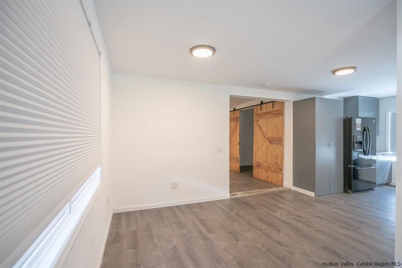 23 Spaulding Lane Saugerties, NY 12477 - Photo 18 of 35 a view of an empty room with wooden floor and a window