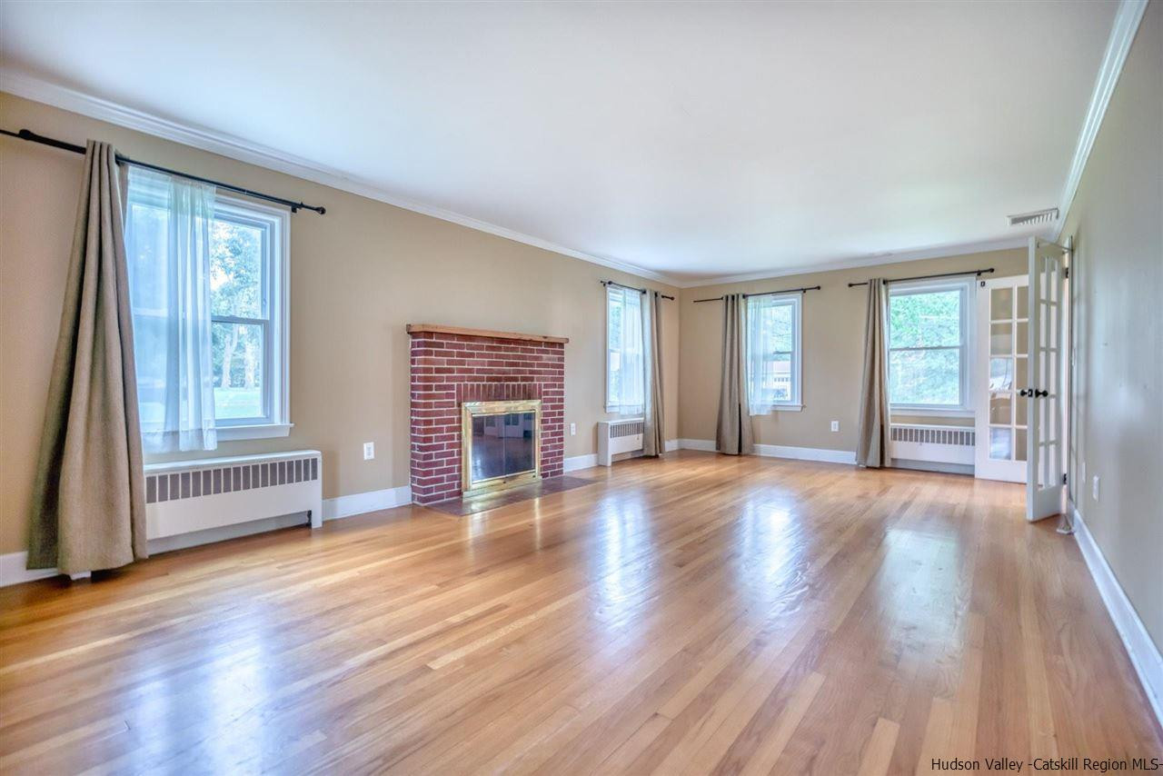 23 Spaulding Lane Saugerties, NY 12477 - Photo 5 of 35 a view of an empty room with wooden floor and a window