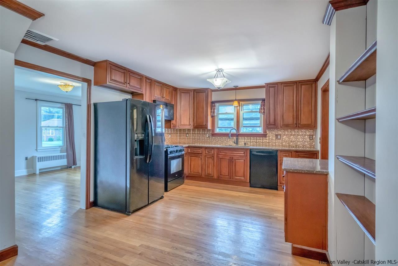 23 Spaulding Lane Saugerties, NY 12477 - Photo 8 of 35 a kitchen with stainless steel appliances granite countertop a refrigerator and a sink