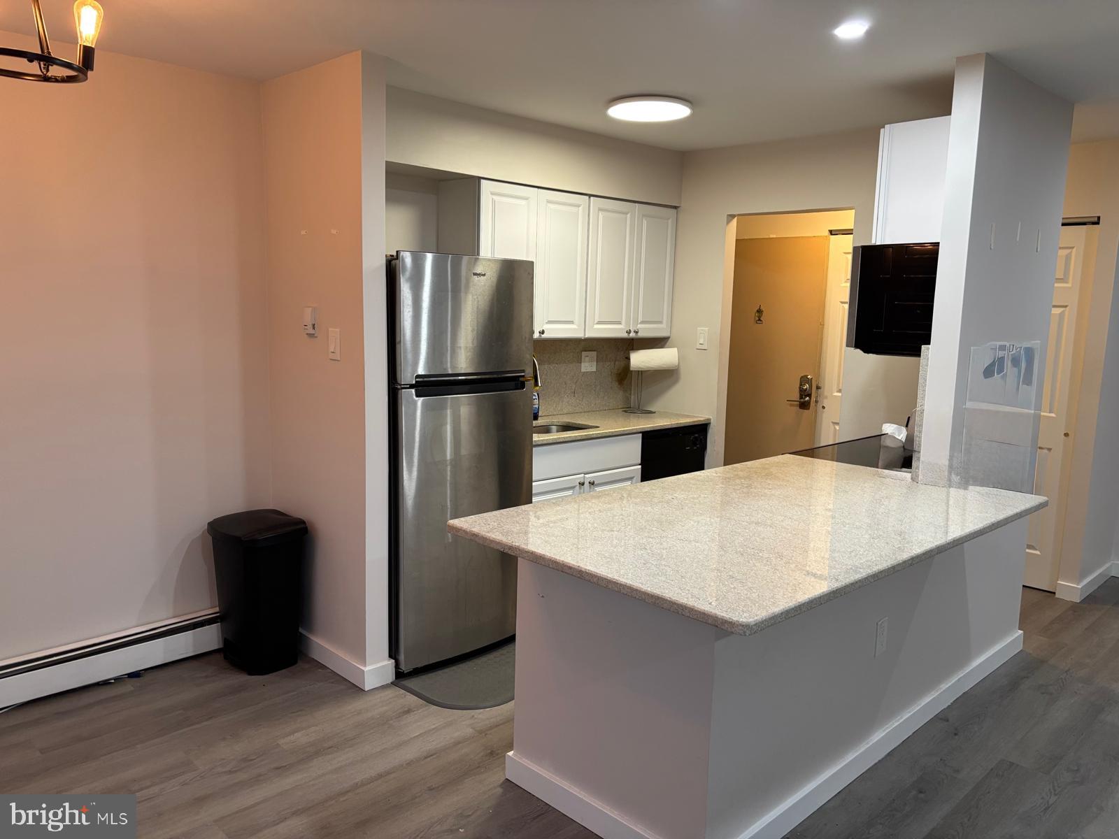 280 Bridgewater Road, Unit D10 Brookhaven, PA 19015 - Photo 8 of 12 a large kitchen with a refrigerator a stove top oven a sink and dishwasher