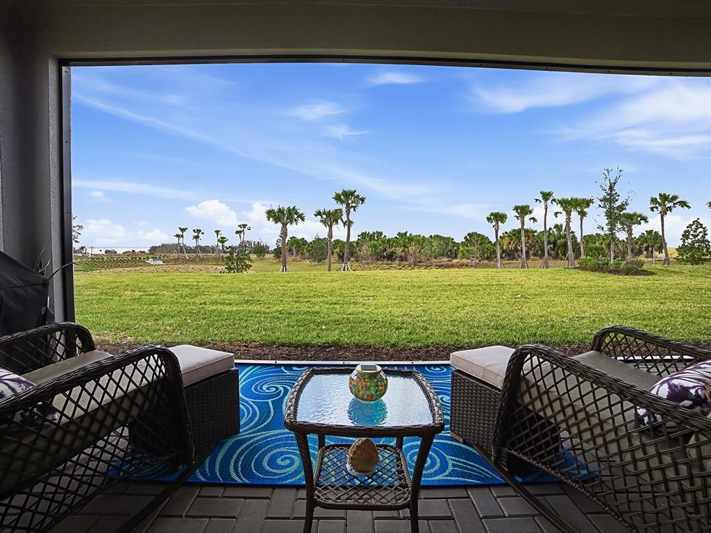 1599 Bellagio Loop Tavares, FL 32778 - Photo 3 of 75 a view of a chairs and table on the terrace