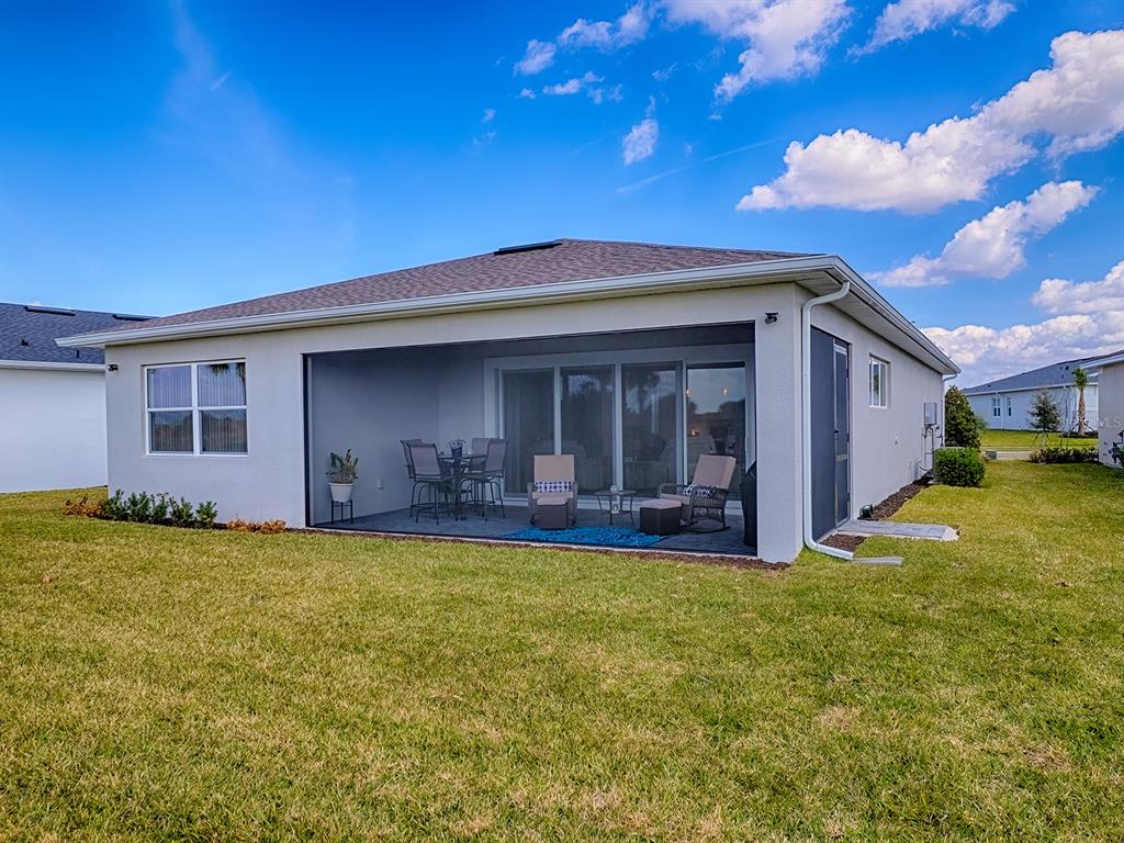 1599 Bellagio Loop Tavares, FL 32778 - Photo 35 of 75 a view of a house with a patio