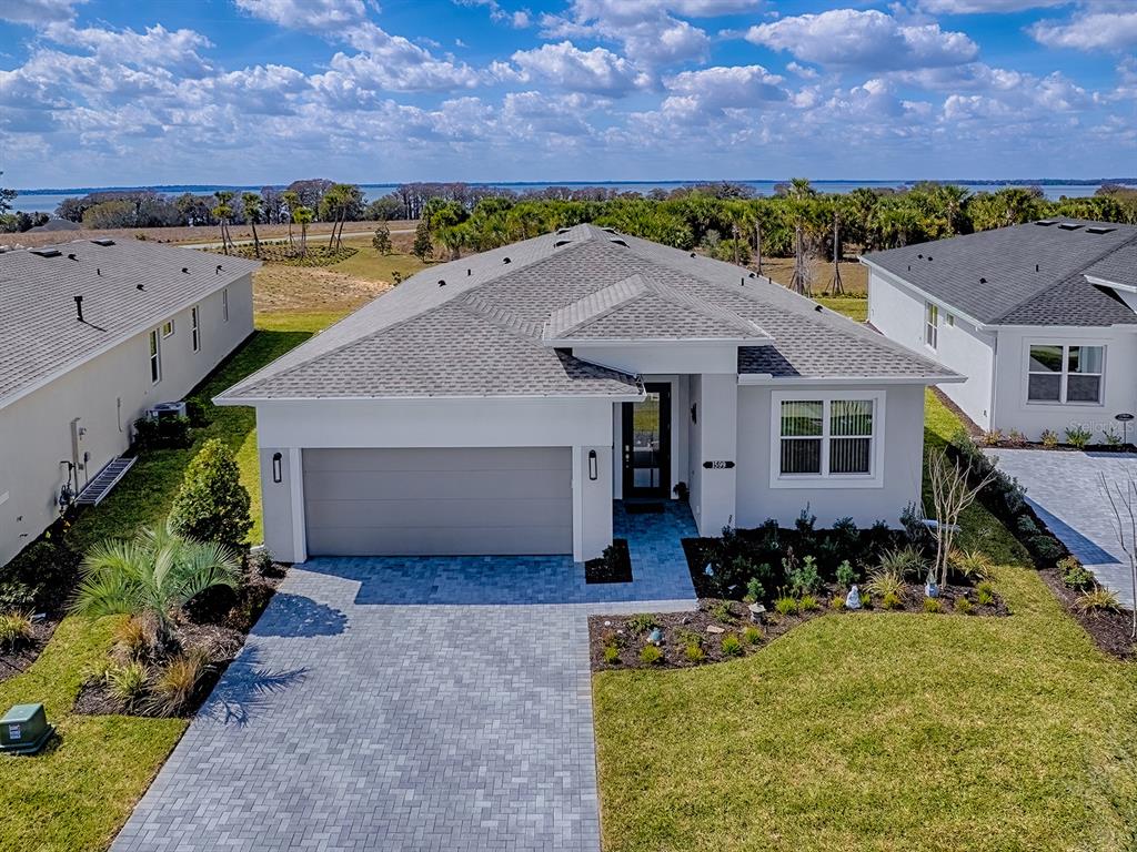 1599 Bellagio Loop Tavares, FL 32778 - Photo 39 of 75 an aerial view of a house with a yard