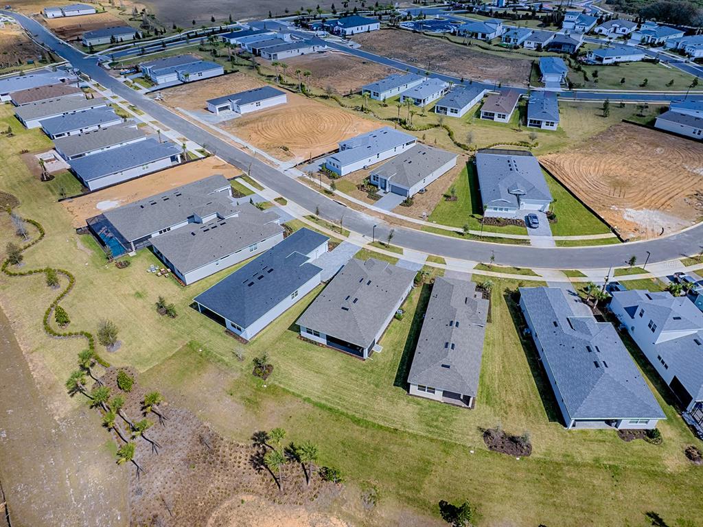 1599 Bellagio Loop Tavares, FL 32778 - Photo 49 of 75 an aerial view of a house with a swimming pool