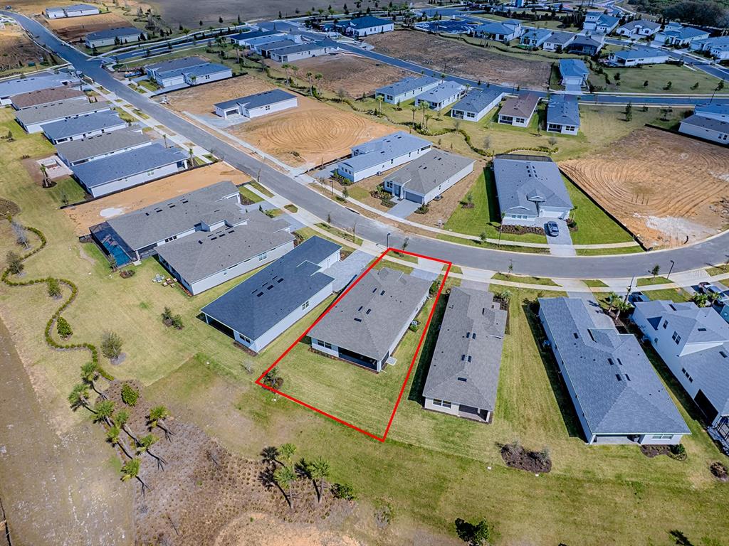 1599 Bellagio Loop Tavares, FL 32778 - Photo 50 of 75 an aerial view of a residential houses with outdoor space