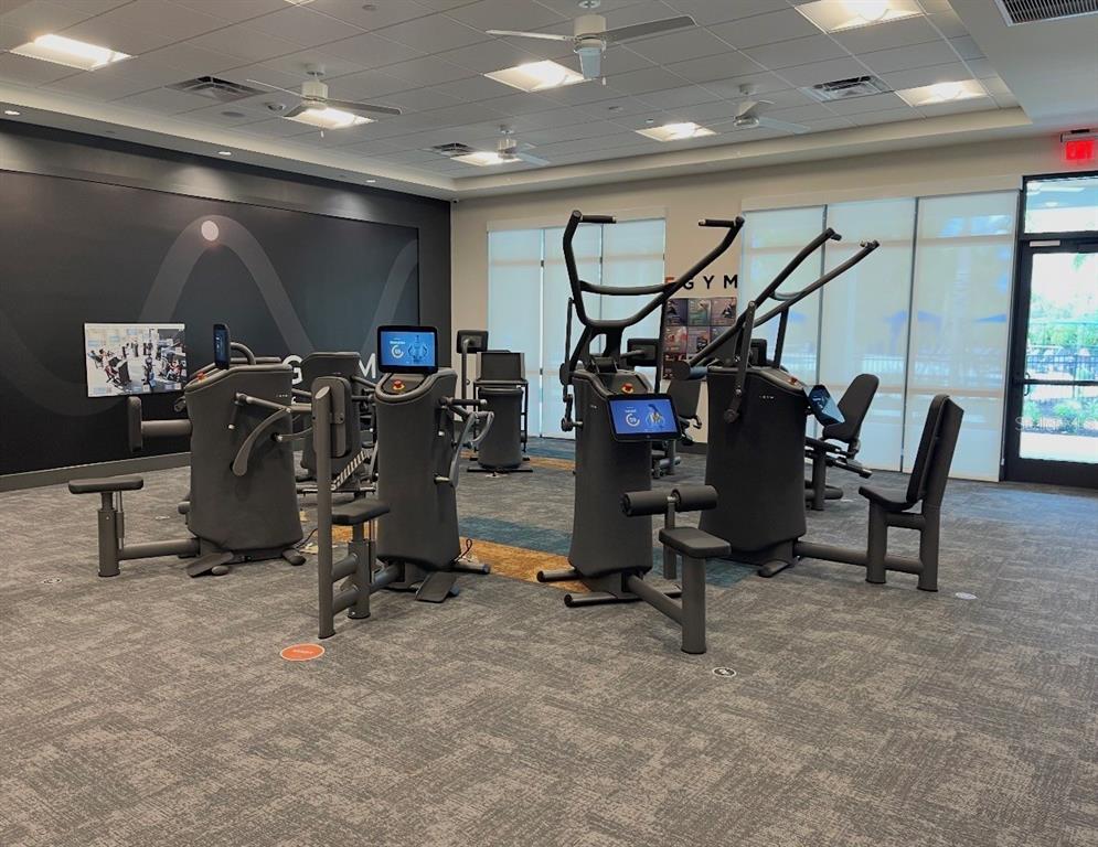 1599 Bellagio Loop Tavares, FL 32778 - Photo 67 of 75 a view of a room with gym equipment