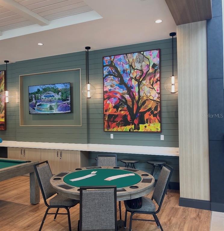 1599 Bellagio Loop Tavares, FL 32778 - Photo 69 of 75 a view of a dining room with furniture a rug and wooden floor