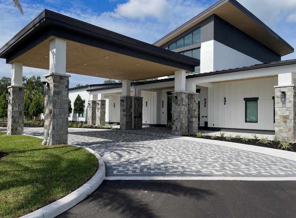 1599 Bellagio Loop Tavares, FL 32778 - Photo 74 of 75 a front view of a house with garden