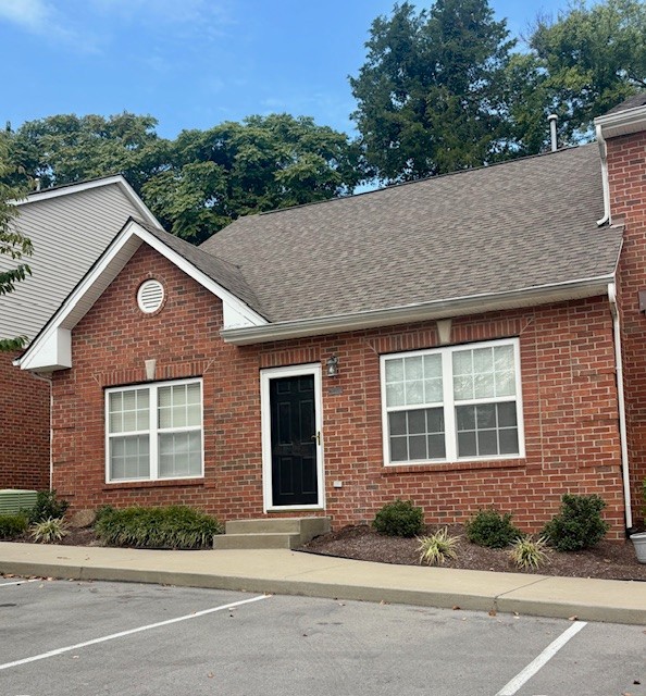 1101 Downs Boulevard, Unit B101 Franklin, TN 37064 - Photo 2 of 18 a front view of a house with a yard