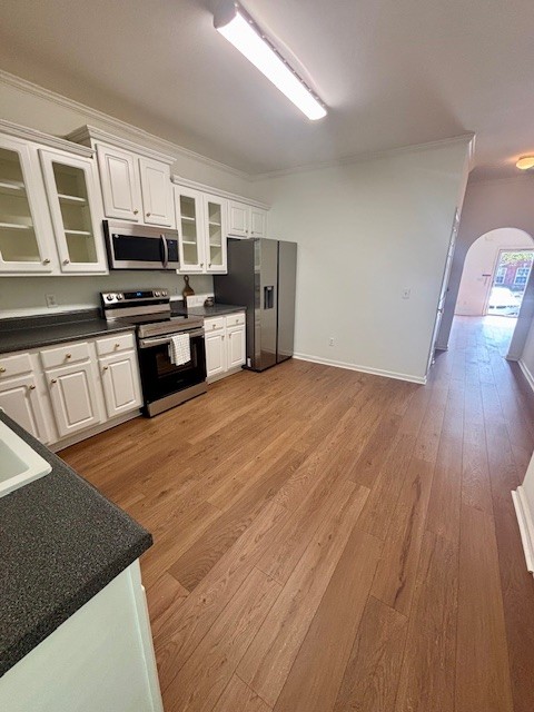 1101 Downs Boulevard, Unit B101 Franklin, TN 37064 - Photo 8 of 18 a kitchen with stainless steel appliances granite countertop a stove a sink and a microwave