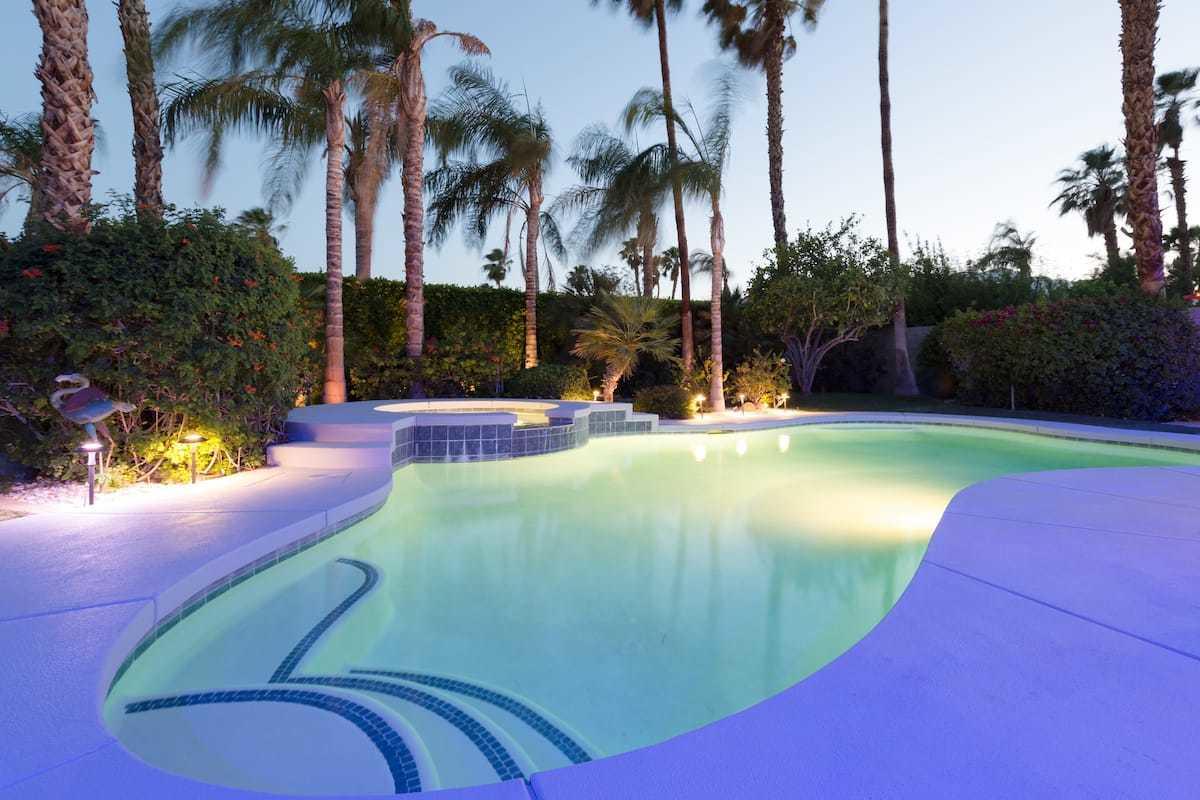 68645 Risueno Road Cathedral City, CA 92234 - Photo 1 of 17 a view of a swimming pool with a sitting space