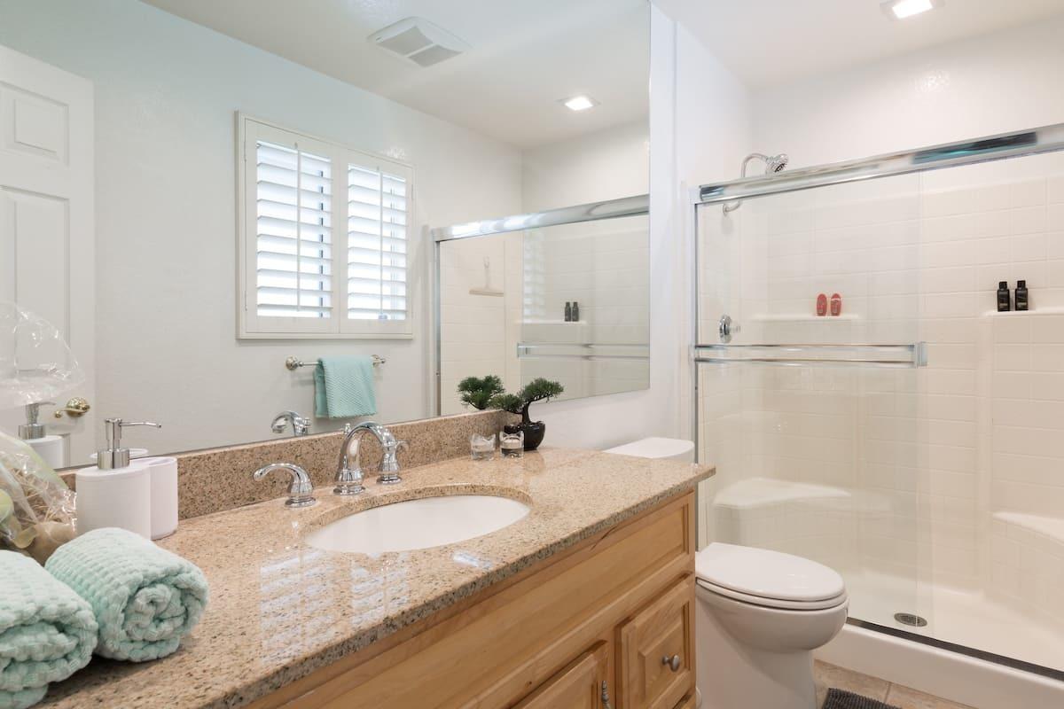 68645 Risueno Road Cathedral City, CA 92234 - Photo 7 of 17 a bathroom with a granite countertop sink toilet and shower