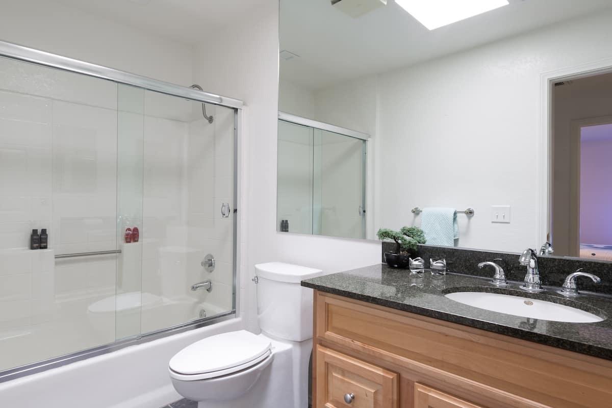 68645 Risueno Road Cathedral City, CA 92234 - Photo 10 of 17 a bathroom with a granite countertop sink toilet and shower