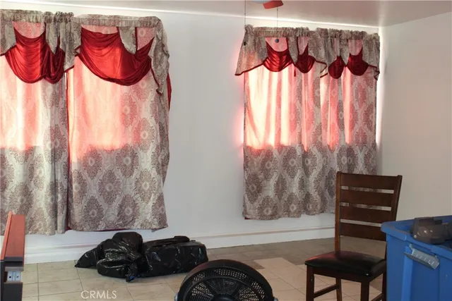 a bench sitting in a room next to a window