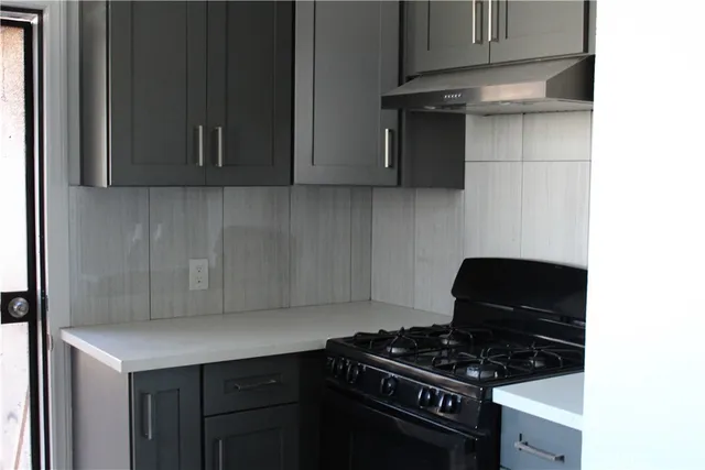 a kitchen with a stove and a microwave