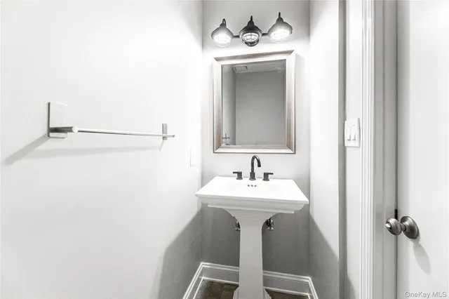 a bathroom with a sink and mirror